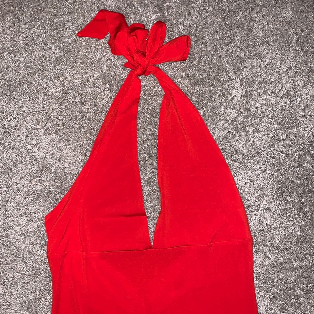 Beautiful floor length dress with a slit, open back, tie up around neck